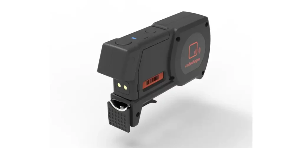 A Small Black Gadget With A Bright Red Button Prominently Displayed