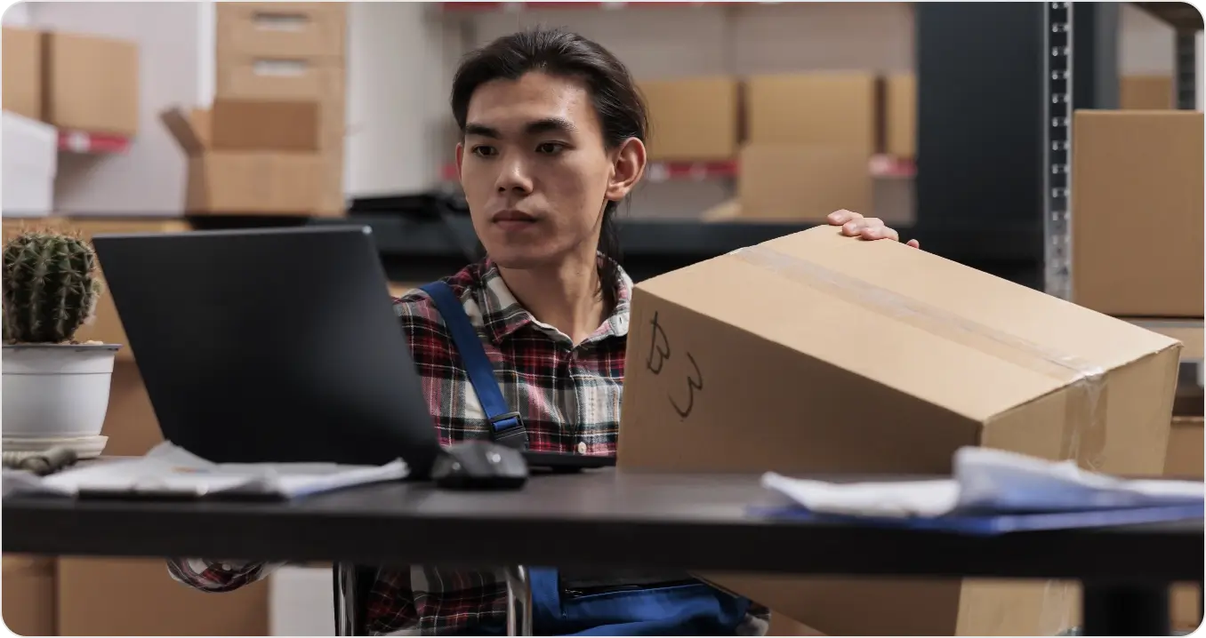 Asian Wheelchair User Managing Parcel Delivery Postal Service Warehouse Storehouse Shipment Operator With Disability Holding Cardboard Box With Custom