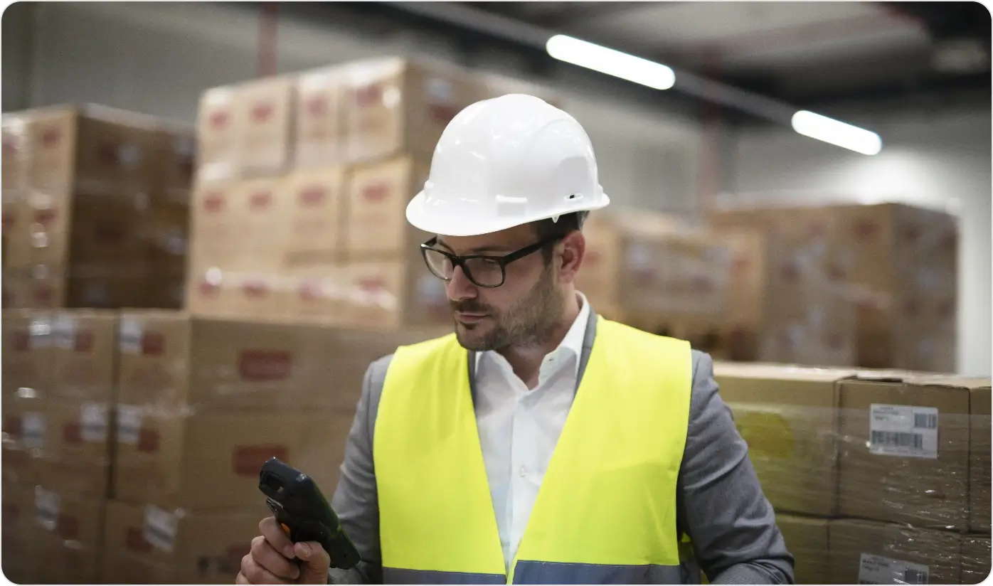 Industrial Worker With Bar Code Scanner Keeping Track Controlling Goods Arriving Warehouse